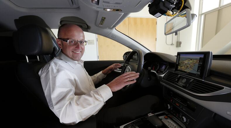 Ewald Goessmann, executive director at the Volkswagen Group Electronics Research Laboratory, shows off an autonomous Audi A7 under development Monday afternoon, March, 30, 2015, in Belmont, Calif. (Karl Mondon/Bay Area News Group/TNS)