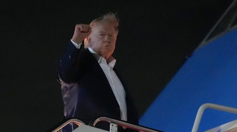 President Donald Trump gestures as he boards Air Force One, Monday, June 15, 2026, at Joint Base Andrews, Md. (AP Photo/Julia Demaree Nikhinson)