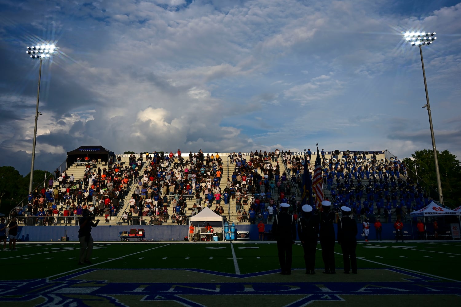 The McEachern Color Guard (bottom right of picture) presents colors prior to the start of their game against North Cobb Friday, August 22, 2025 at McEachern.  (Daniel Varnado/For the Atlanta Journal-Constitution)