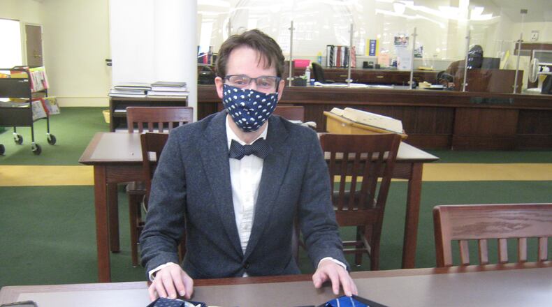 David Russell, reference librarian with the DeKalb County Public Library, started a lending "tiebrary" for those in need of neckwear.