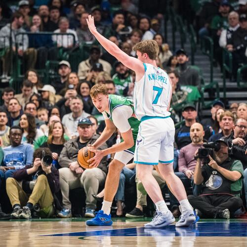 Charlotte Hornets guard Kon Knueppel (7) defends against Dallas Mavericks forward Cooper Flagg, center left, during an NBA basketball game, Thursday, Jan. 29, 2026, in Dallas. (AP Photo/Jessica Tobias)