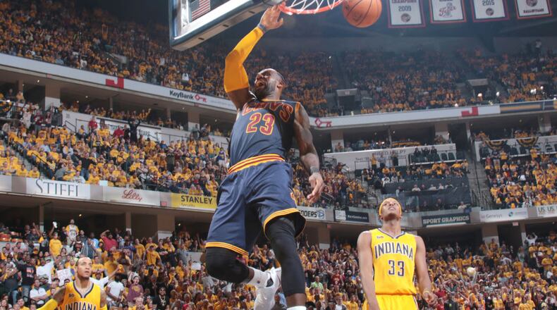 LeBron James (23) of the Cleveland Cavaliers dunks against the Indiana Pacers during Game 3 of the Eastern Conference quarterfinals Thursday night.