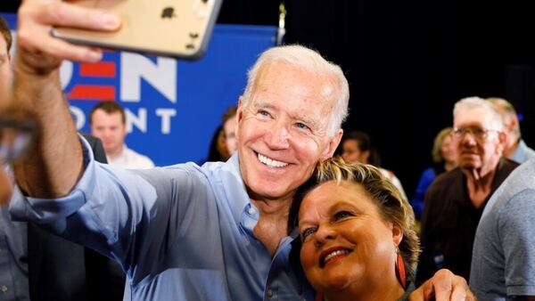 Democratic presidential candidate former Vice President Joe Biden poses for a photo with an audience member after speaking at Clinton Community College, Wednesday, June 12, 2019, in Clinton, Iowa.