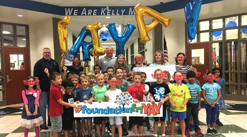 Students at Kelly Mill Elementary School celebrate receiving a $4,064 grant from the Forsyth County Education Foundation to help them grow a vegetable garden to supply the school cafeteria and local food banks. FORSYTH COUNTY SCHOOLS