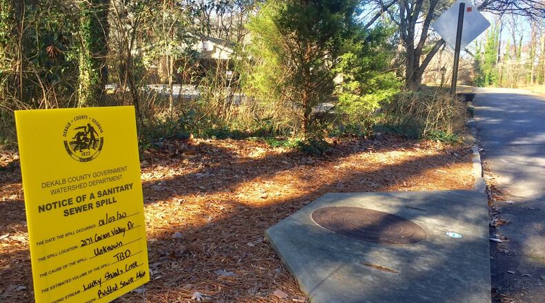 A sign notes a recent sewer spill in DeKalb County.