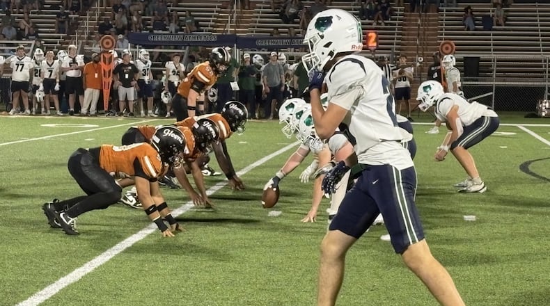 Kell’s defense (left) digs in for a play during the fourth quarter of the Longhorns’ 41-21 victory over Creekview on Friday, Sept. 18, 2026, in Marietta. (Chip Saye/AJC)