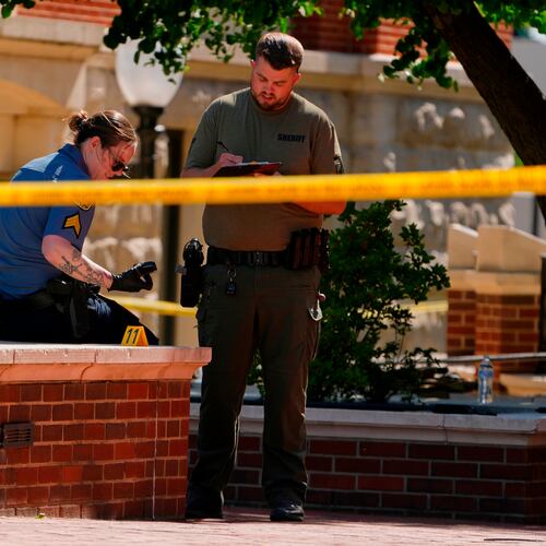 Sheriff's deputies investigate a shooting scene outside the Montgomery County Courthouse, Wednesday, May 13, 2026, in Clarksville, Tenn. (AP Photo/George Walker IV)