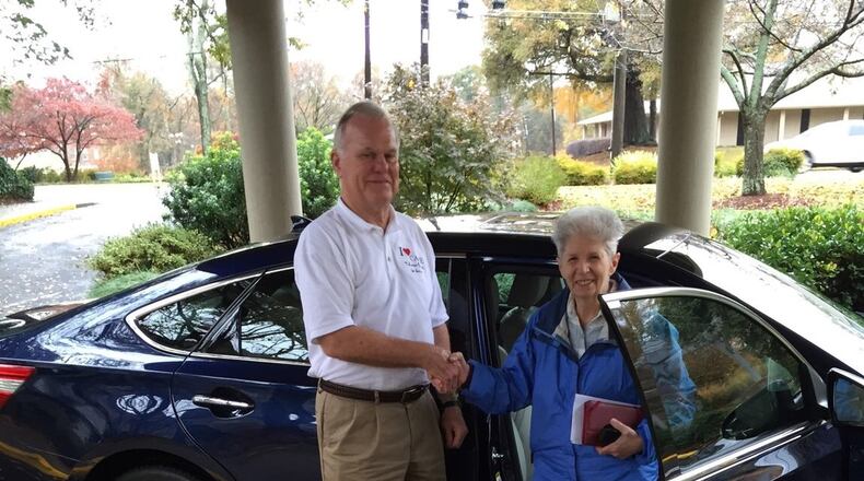I Care volunteer driver Dennis Nelson assists I Care client Carol Houlihan in getting in and out of his vehicle on a trip to one of her medical appointments. The nonprofit organization provides free door-to-door transportation to medical appointments for DeKalb County seniors ages 55 and older. CONTRIBUTED BY I CARE