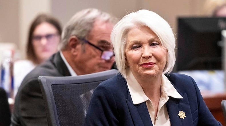 FILE - Former Mesa County Clerk and Recorder Tina Peters smiles at supporters sitting behind her during her sentencing for her election interference case at the Mesa County District Court, Thursday, Oct. 3, 2024, in Grand Junction, Colo. (Larry Robinson/The Grand Junction Daily Sentinel via AP, File)