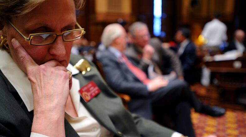 Rep. Sharon Cooper (R-Marietta) became the highest-ranking woman in the Georgia House in 2004 as the Majority Caucus Chairman and is currently serving her sixth term in the Georgia House of Representatives. "Women make up 50 percent of the population across the nation almost no legislature has more than 25 percent women, which I think is a shame because I think we have a different way of working with people," Cooper said. "I never planned to run for office so I really didn't know what to expect when I came down here. It's different from anything you ever do. I was shocked by the fact that it was still such a good old boy system." (Elissa Eubanks/AJC) CALL ME IF YOU NEED ANYTHING 404-374-2608 We talked about this being secondary on front. Also, here is a link to her profile if you need more on her. http://www.legis.state.ga.us/legis/2007_08/house/bios/cooperSharon/cooperSharonBio.htm