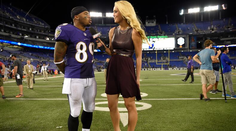 FILE - In this Sept. 11, 2014, file photo, Baltimore Ravens wide receiver Steve Smith (89) is interviewed after an NFL football game against the Pittsburgh Steelers by ESPN reporter Britt McHenry, right, in Baltimore. ESPN has suspended reporter Britt McHenry after a video surfaced of her insulting a towing company clerk's intelligence, job and appearance. ESPN spokesman Josh Krulewitz said Thursday, April 16, that McHenry has been suspended for a week. (AP Photo/Nick Wass, File) Britt McHenry, in a more civil moment, interviews the Baltimore Ravens' Steve Smith, September 2014. (AP Photo / Nick Wass)