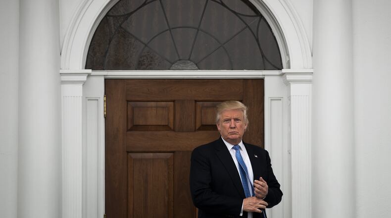 BEDMINSTER TOWNSHIP, NJ - NOVEMBER 20: President-elect Donald Trump stands outside the clubhouse following his meeting with Peter Kirsanow, attorney and member of the U.S. Commission on Civil Rights, at Trump International Golf Club, November 20, 2016 in Bedminster Township, New Jersey. Trump and his transition team are in the process of filling cabinet and other high level positions for the new administration. (Photo by Drew Angerer/Getty Images)