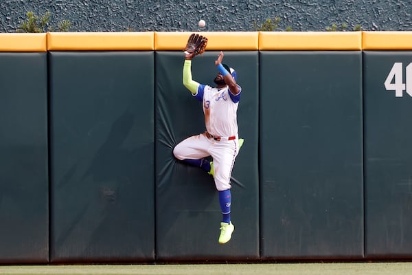 Atlanta Braves outfielder Michael Harris II catches a deep fly ball for an out against Boston Red Sox's Trevor Story during the third inning of a baseball game, Saturday, May 31, 2025, in Atlanta. (AP Photo/Butch Dill)