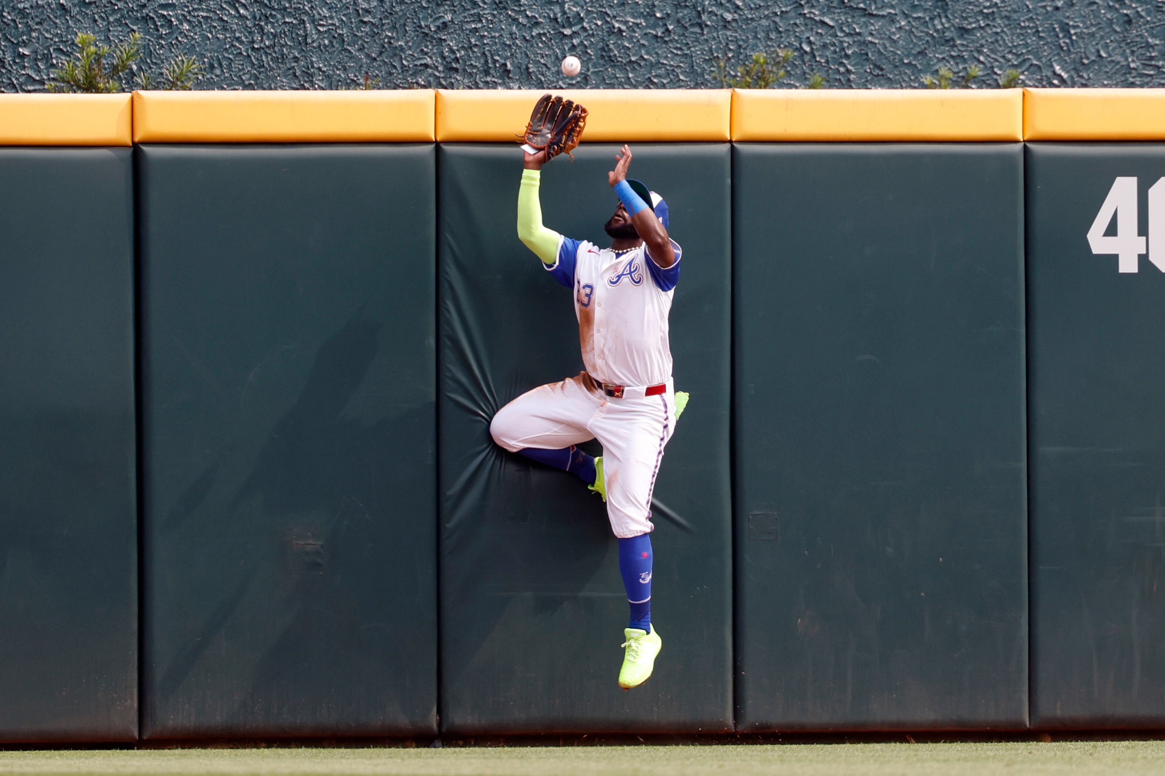 Atlanta Braves outfielder Michael Harris II catches a deep fly ball for an out against Boston Red Sox's Trevor Story during the third inning of a baseball game, Saturday, May 31, 2025, in Atlanta. (AP Photo/Butch Dill)