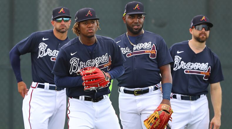 Braves outfielders ready for action: (from left) Nick Markakis, Ronald Acuna, Marcell Ozuna and Ender Inciarte get in some work Wednesday during spring training activities at CoolToday Park in North Port, Fla. (Curtis Compton/ccompton@ajc.com)