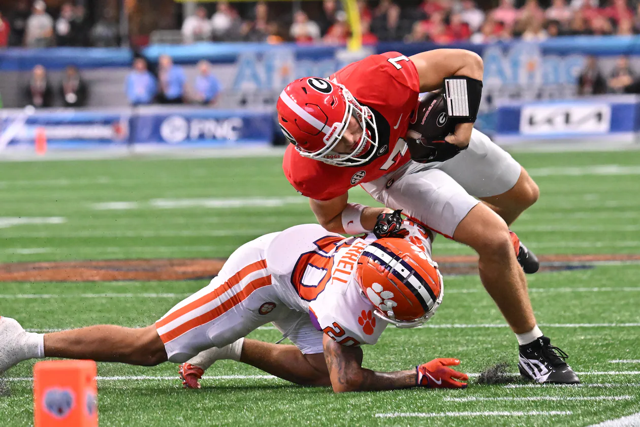 Georgia tight end Lawson Luckie (right) gets tacked by Clemson cornerback Avieon Terrell at Mercedes-Benz Stadium on Saturday, Aug. 31, 2024, in Atlanta. The Falcons selecting Terrell at No. 48 overall in the second round of the 2026 NFL draft. (Hyosub Shin/AJC 2024)