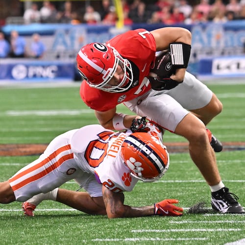 Georgia tight end Lawson Luckie (right) gets tacked by Clemson cornerback Avieon Terrell at Mercedes-Benz Stadium on Saturday, Aug. 31, 2024, in Atlanta. The Falcons selecting Terrell at No. 48 overall in the second round of the 2026 NFL draft. (Hyosub Shin/AJC 2024)