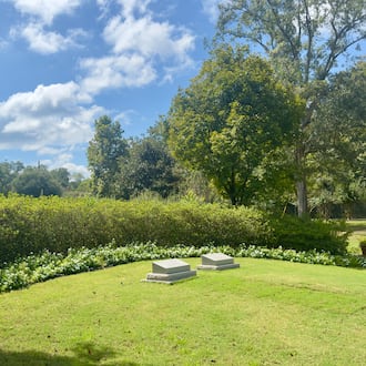 Former President Jimmy Carter's gravestone (left) lies next to that of former first lady Rosalynn Carter in their burial plot, which was recently opened to the public in their hometown of Plains. It was closed Wednesday amid the federal government shutdown. (Joe Kovac Jr./AJC)