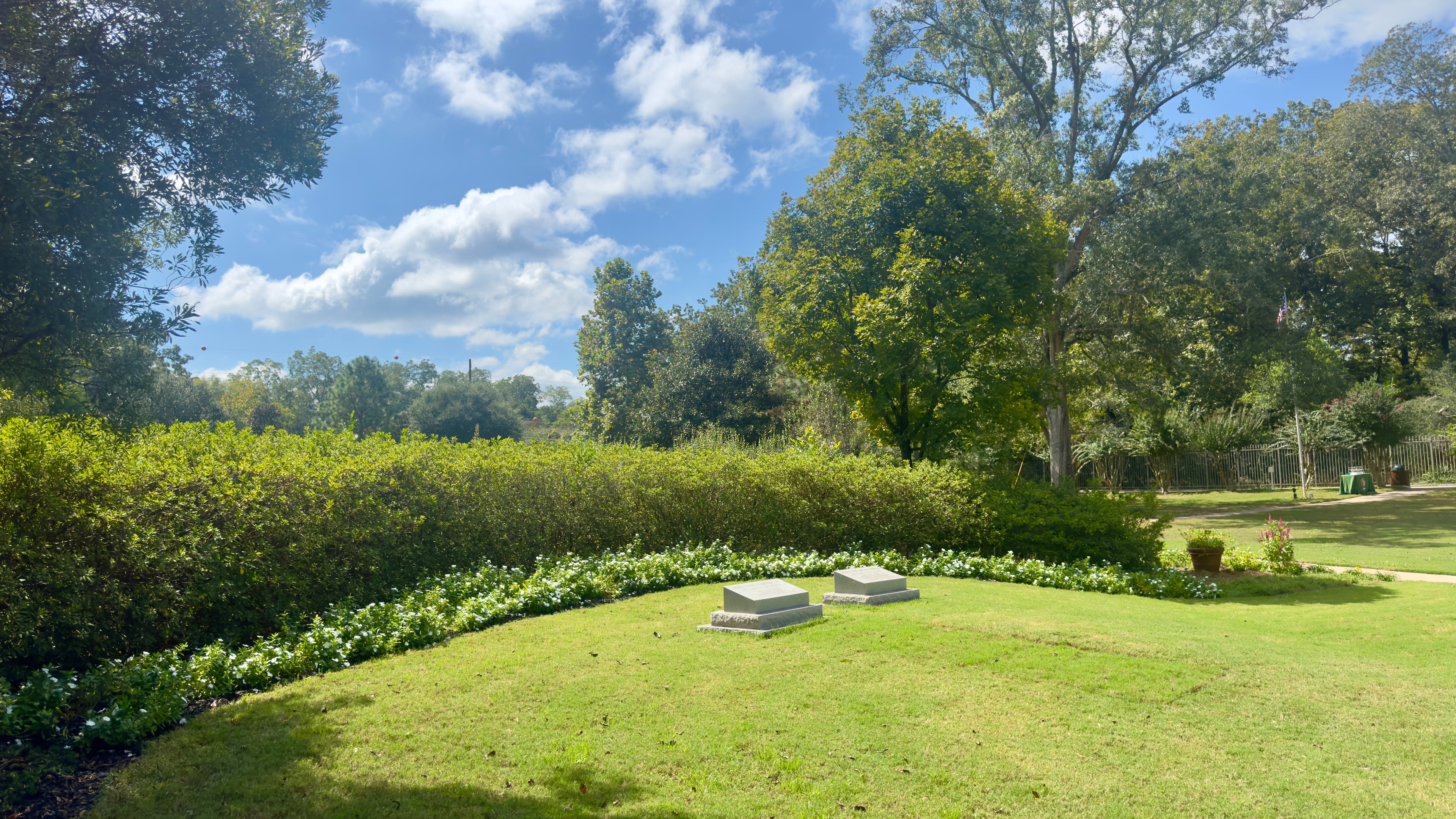 Former President Jimmy Carter's gravestone (left) lies next to that of former first lady Rosalynn Carter in their burial plot, which was recently opened to the public in their hometown of Plains. It was closed Wednesday amid the federal government shutdown. (Joe Kovac Jr./AJC)
