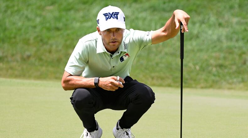 Eric Cole lines up his putt on the 18th green during the first round of the Travelers Championship golf tournament at TPC River Highlands, Thursday, June 25, 2026, in Cromwell, Conn. (AP Photo/Jessica Hill)