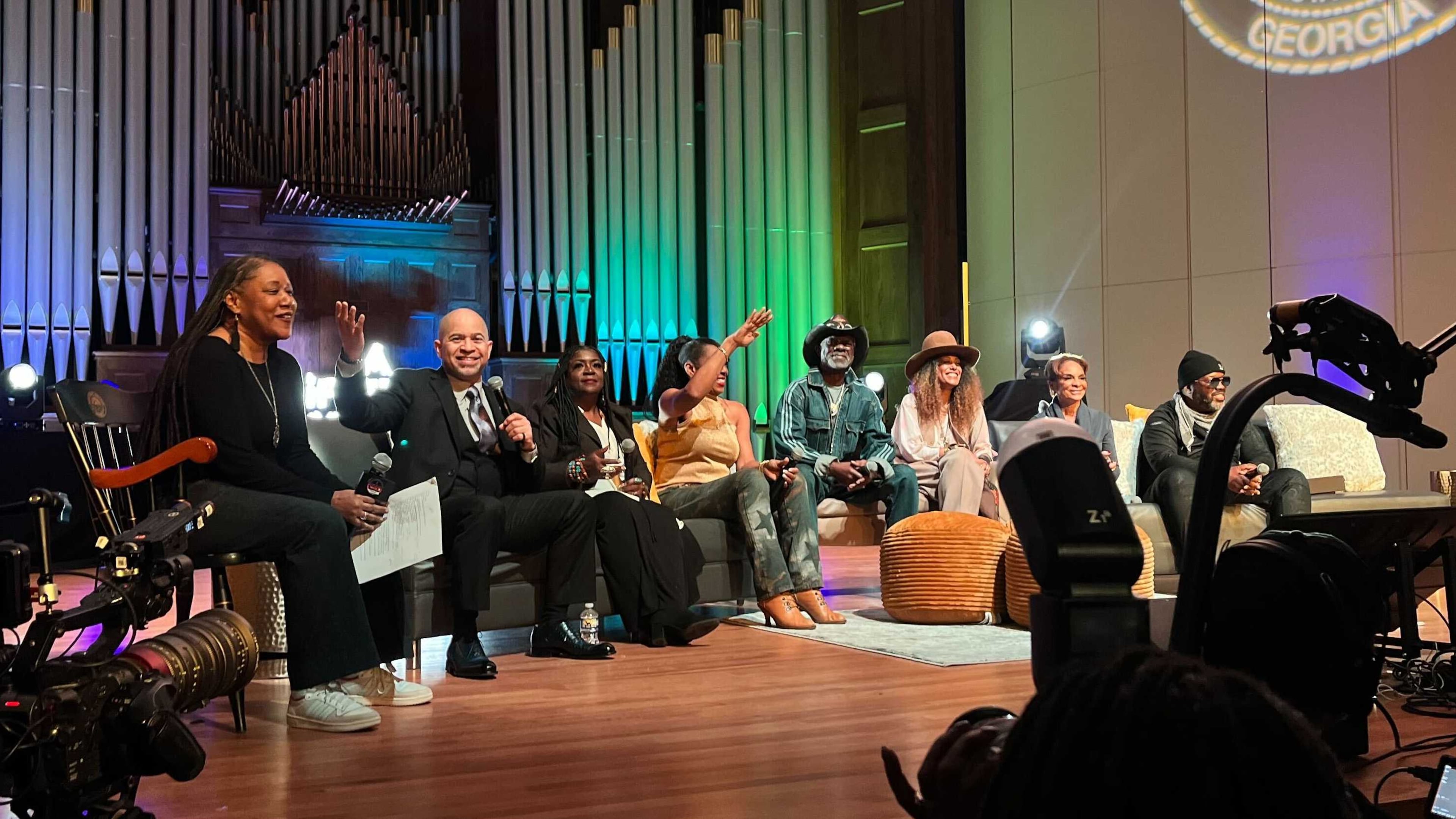 Cast members from the "A Different World" visited Morehouse College and other historically Black colleges and universities in Atlanta in February 2024. Holding the microphone is Darryl M. Bell, who played student Ron Johnson at Hillman College, a fictional HBCU. (Auzzy Byrdsell/AJC 2024)