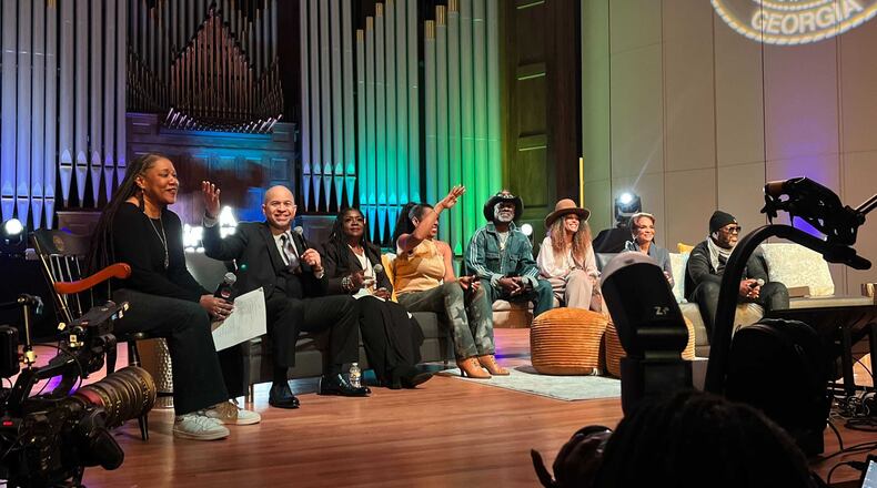 Cast members from the hit television sitcom "A Different World" visited the Morehouse College Martin Luther King International Chapel and other historically Black colleges and universities in Atlanta on Feb. 29, 2024. Darryl M. Bell holding the microphone, talked about his experience on the show, which chronicled life at Hillman College, a fictional HBCU. Bell played student Ron Johnson on the show. (Auzzy Byrdsell / Auzzy.Byrdsell@ajc.com)