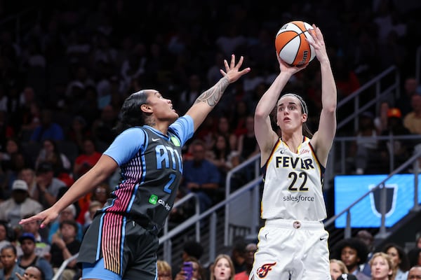Indiana Fever guard Caitlin Clark (22) attempts a shot in the first half of an WNBA basketball game against the Atlanta Dream, Thursday, May, 22, 2025, in Atlanta. (AP Photo/Colin Hubbard)