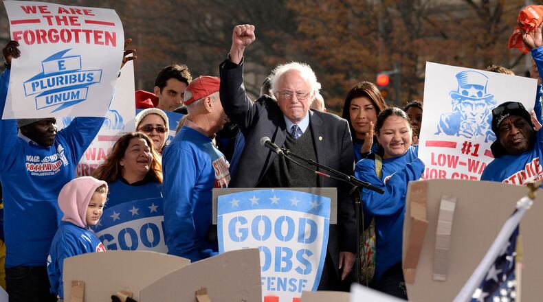 Sen. Bernie Sanders joins striking federal contract workers during their rally to hold President-elect Donald Trump accountable to keeping his promise to workers Dec. 7, 2016 in Washington, D.C. (Olivier Douliery/Abaca Press/TNS)