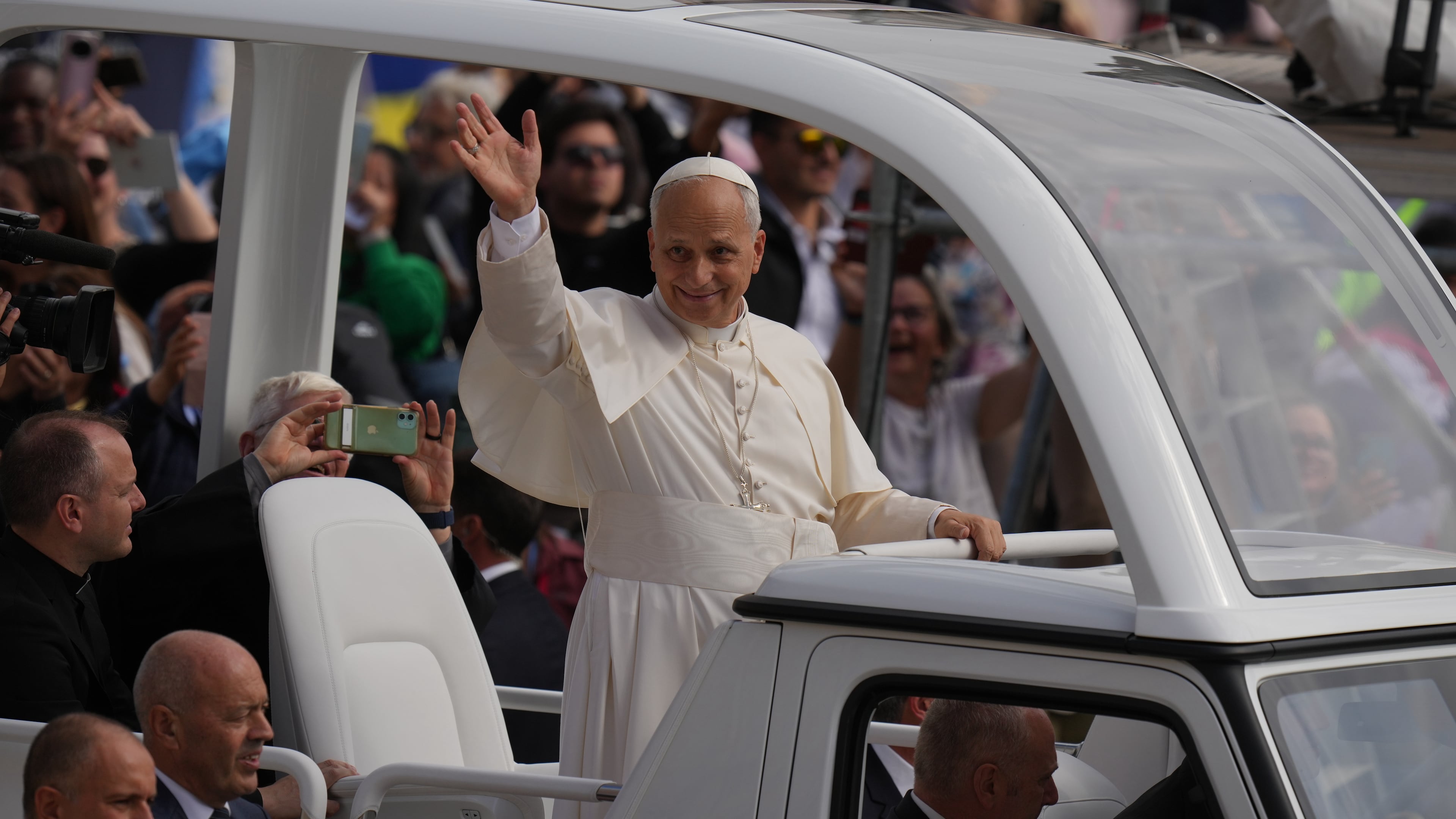 Pope Leo XIV waves from his popemobile at the end of a Mass for the Jubilee of Migrants and Missionaries in St. Peter's Square at the Vatican, Sunday, Oct. 5, 2025. (AP Photo/Alessandra Tarantino)