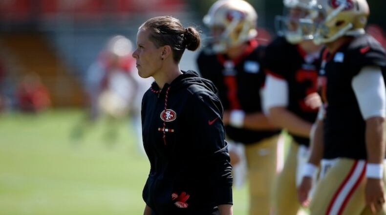 Katie Sowers, a coaching intern for the San Francisco 49ers, keeps an eye on training camp in Santa Clara, Calif., on Aug. 8, 2017. (Karl Mondon/Bay Area News Group/TNS)