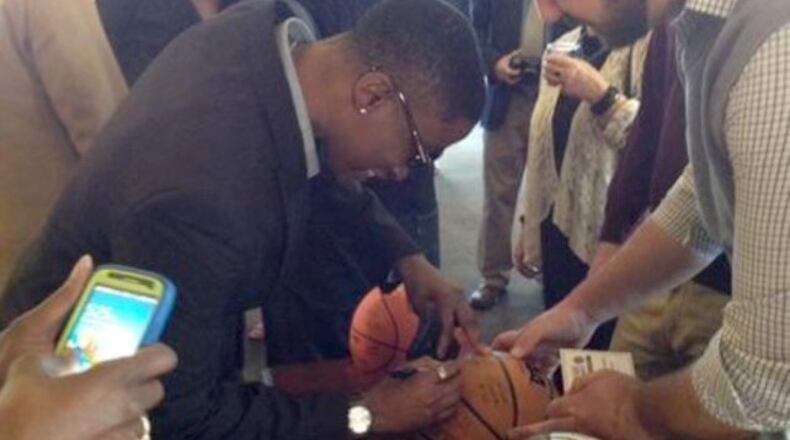 Latonya McMorris autographs basketballs at the Women's Final Four in 2001, where her team -- the Lady Bears of Missouri State, finished in the top four. She says she learned some great skills on the court -- leadership, teamwork, and perseverance. Courtesy of Latonya McMorris