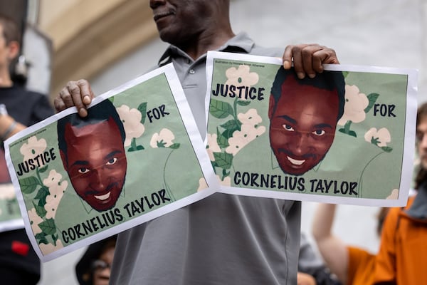 Activists and former residents of Old Wheat Street gathered to demand justice for Cornelius Taylor in front of City Hall in Atlanta on Monday, Oct. 6, 2025. Taylor was killed by the City of Atlanta during a sweep of an encampment of unhoused residents earlier this year. (Arvin Temkar/AJC)
