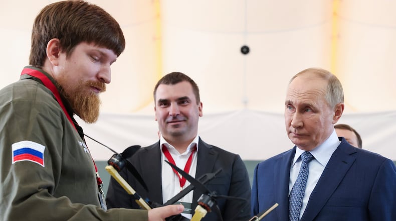 FILE - Russian President Vladimir Putin, right, speaks with Vladimir Tkachuk, the head of the Uraldronzavod, during his visit to the Special Technology Centre in St. Petersburg, Russia, Thursday, Sept. 19, 2024. (Valeriy Sharifulin, Sputnik, Kremlin Pool Photo via AP, File)
