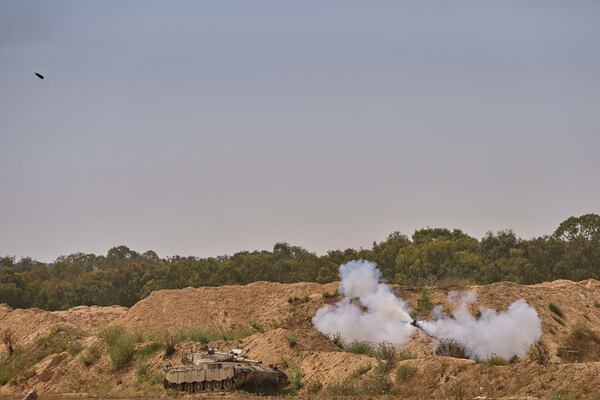 An Israeli mobile artillery unit fires a shell from southern Israel towards the Gaza Strip, in a position near the Israel-Gaza border on Tuesday, May 6, 2025. (AP Photo/Ohad Zwigenberg)