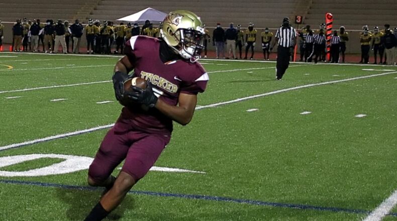 Tucker receiver Isaiah Raheem (7) hauls in the second of his two touchdown catches in the Tigers 29-12 win over the Southwest DeKalb Panthers. (Photo by Mark Brock)