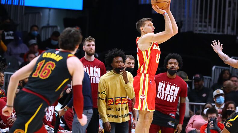 Atlanta's Bogdan Bogdanovic hits a 3 against the Cleveland Cavaliers during the final minutes of a 124-116 victory Tuesday night in Atlanta. (Curtis Compton / Curtis.Compton@ajc.com)