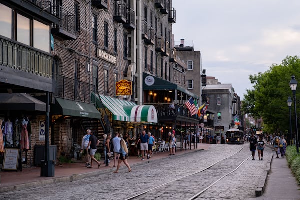Visitors walk along River Street in Savannah, Georgia, on May 3rd, 2024. (Rosana Lucia for The Atlanta Journal-Constitution)
