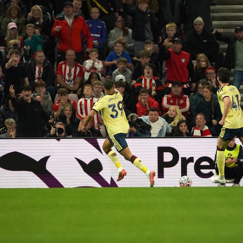 Arsenal's Bruno Guimaraes, center, celebrates after scoring the opening goal during the English Premier League soccer match between Sunderland and Arsenal in Sunderland, England, Saturday, Sept. 12, 2026. (AP Photo/Ian Hodgson)