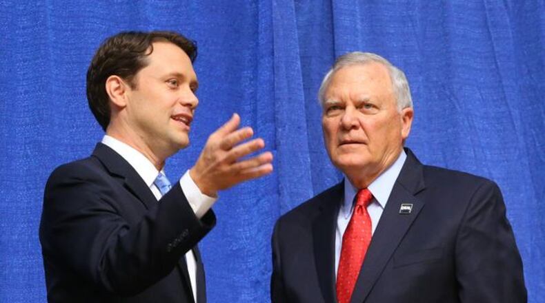 Gov. Nathan Deal and Democrat Jason Carter talk before a debate.