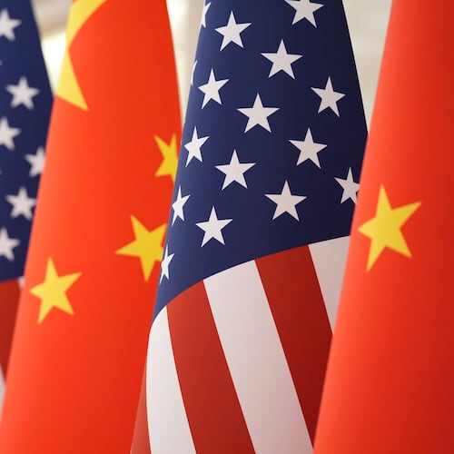 FILE - The U.S. and Chinese flag at the Great Hall of the People prior to the state dinner of President Donald Trump and Chinese President Xi Jinping on May 14, 2026, in Beijing. (AP Photo/Mark Schiefelbein, File)