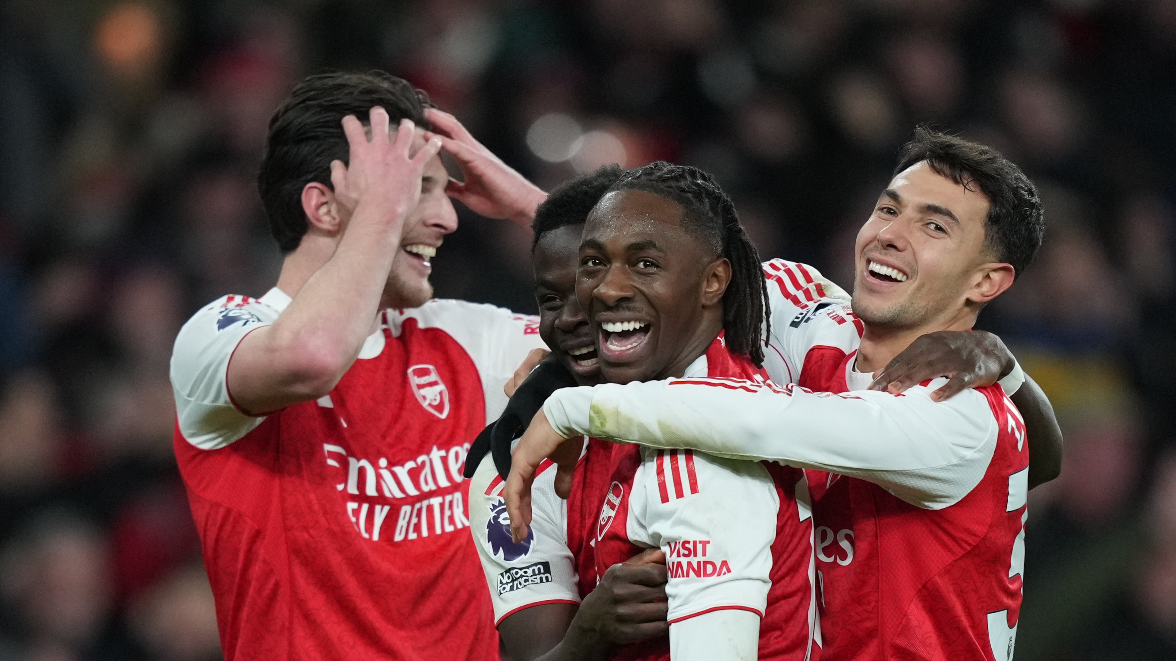 Arsenal's Eberechi Eze , centerm smiles after scoring during a Premier League soccer match between Arsenal and Tottenham in London, Sunday, Nov. 23, 2025. (AP Photo/Frank Augstein)