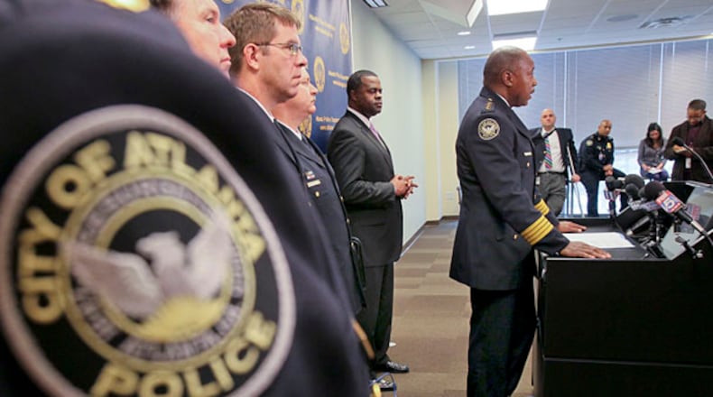 From left, APD Capt. J.P. Spillane, Assistant Chie, P.N. Andresen, Deputy Chief C.W. Moss, Mayor Kasim Reed were on hand as APD Chief George Turner addressed reporters on Monday about the controversial Red Dog narcotics unit. The unit was at the center of the botched Atlanta Eagle raid in 2009.