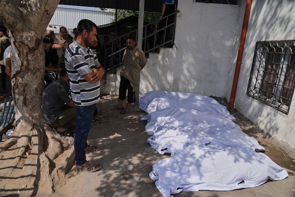 Palestinians mourn their relatives who were killed in an Israeli military strike on Gaza, during their funeral in al-Shifa hospital in Gaza City, Tuesday, June 10, 2025. (AP Photo/Jehad Alshrafi)
