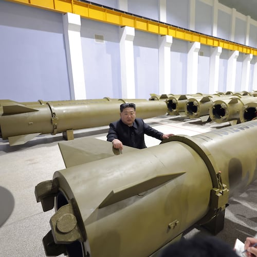 In this photo provided by the North Korean government, its leader Kim Jong Un, center, visits a weapons factory at an undisclosed place in North Korea Saturday, June 6, 2026. Independent journalists were not given access to cover the event depicted in this image distributed by the North Korean government. The content of this image is as provided and cannot be independently verified. Korean language watermark on image as provided by source reads: "KCNA" which is the abbreviation for Korean Central News Agency. (Korean Central News Agency/Korea News Service via AP)