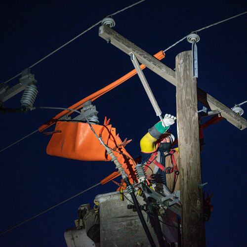 FILE - Oncor apprentice lineman Brendan Waldon repairs a utility pole that was damaged by a winter storm on Feb. 18, 2021, in Odessa, Texas. (Eli Hartman/Odessa American via AP, File)