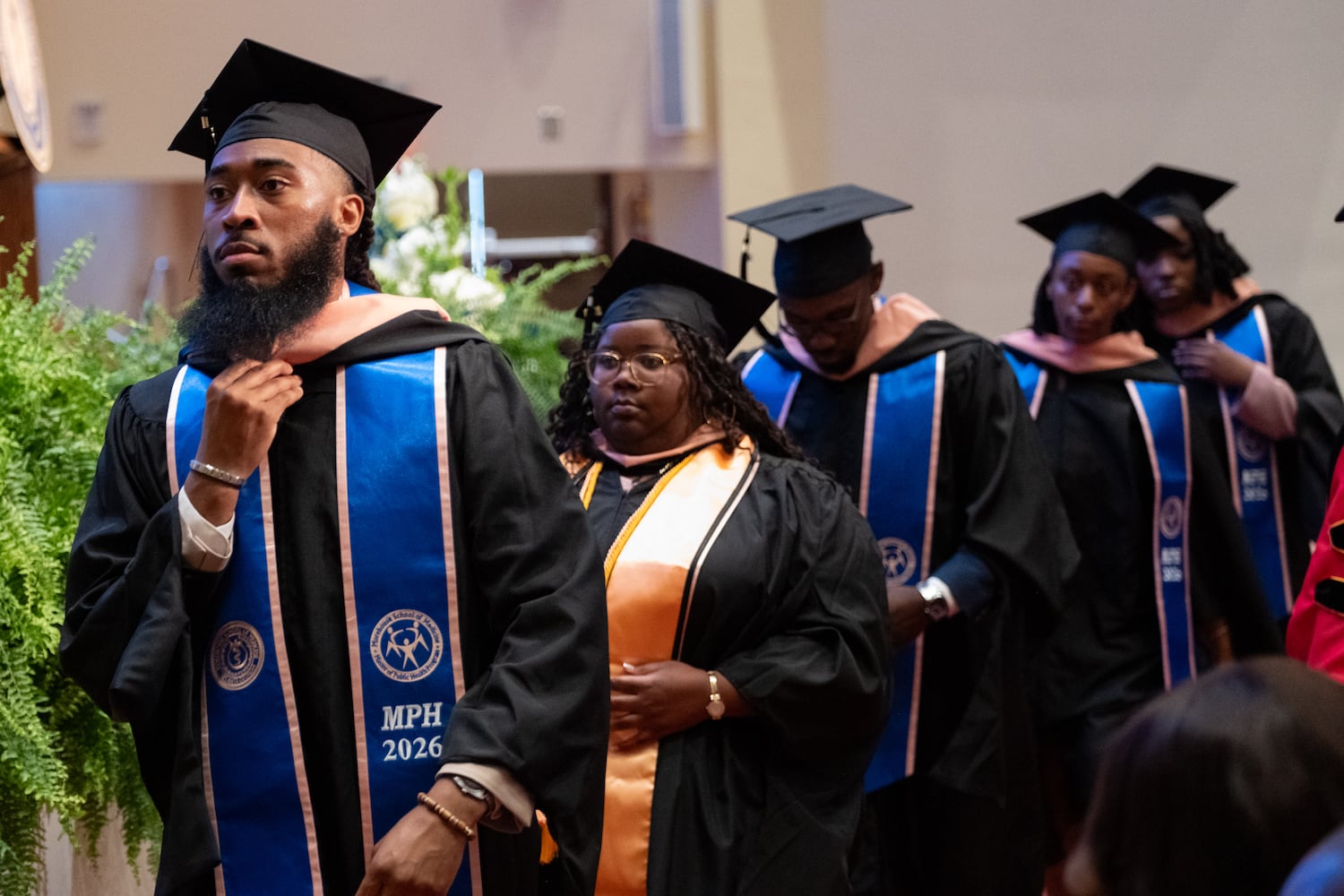 Masters of Public Health students head to the stage to receive their degrees during the graduation ceremony for Morehouse School of Medicine on Saturday, May 16, 2026, in Atlanta. (Ben Gray for the AJC)