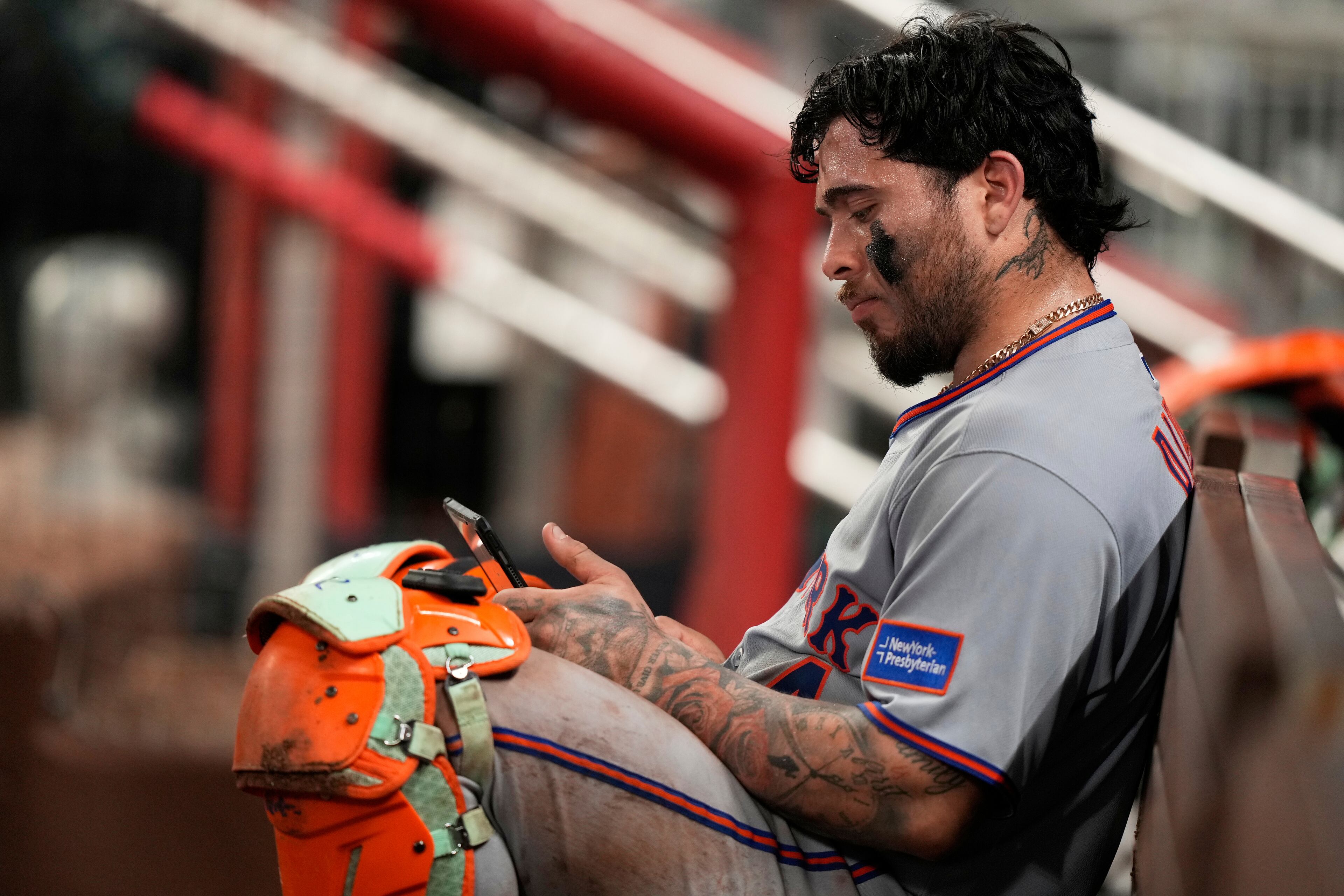 Mets catcher Francisco Alvarez sulks in the dugout after the Braves' walk-off win.