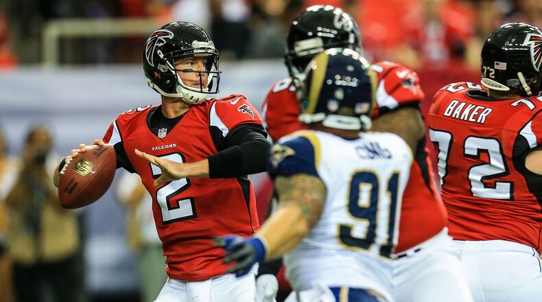 The Dolphins fell behind the curve in the 2008 draft when they selected left tackle Jake Long with the top pick rather than Matt Ryan, shown passing here against St. Louis. Ryan went third overall, just after the Rams took defensive end Chris Long, who in this photo is pressuring Ryan. (Daniel Shirey/USA Today Sports)