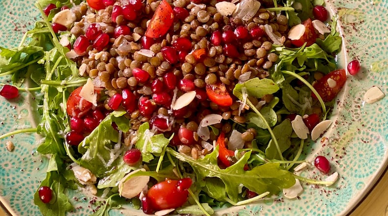 Brand’s Arugula with warm lentils and pomegranate is the perfect healthy meal for fall or winter. 
Courtesy of Paulina Brand
