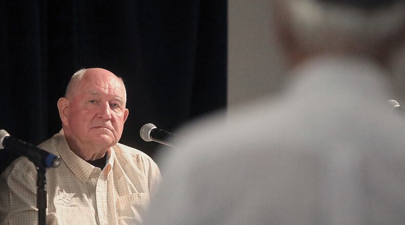 U.S. Secretary of Agriculture Sonny Perdue listens to a question from a Wisconsin farmer during a town hall meeting at the World Dairy Expo in Madison, Wis. Tuesday, Oct. 1, 2019. (John Hart/Wisconsin State Journal via AP)